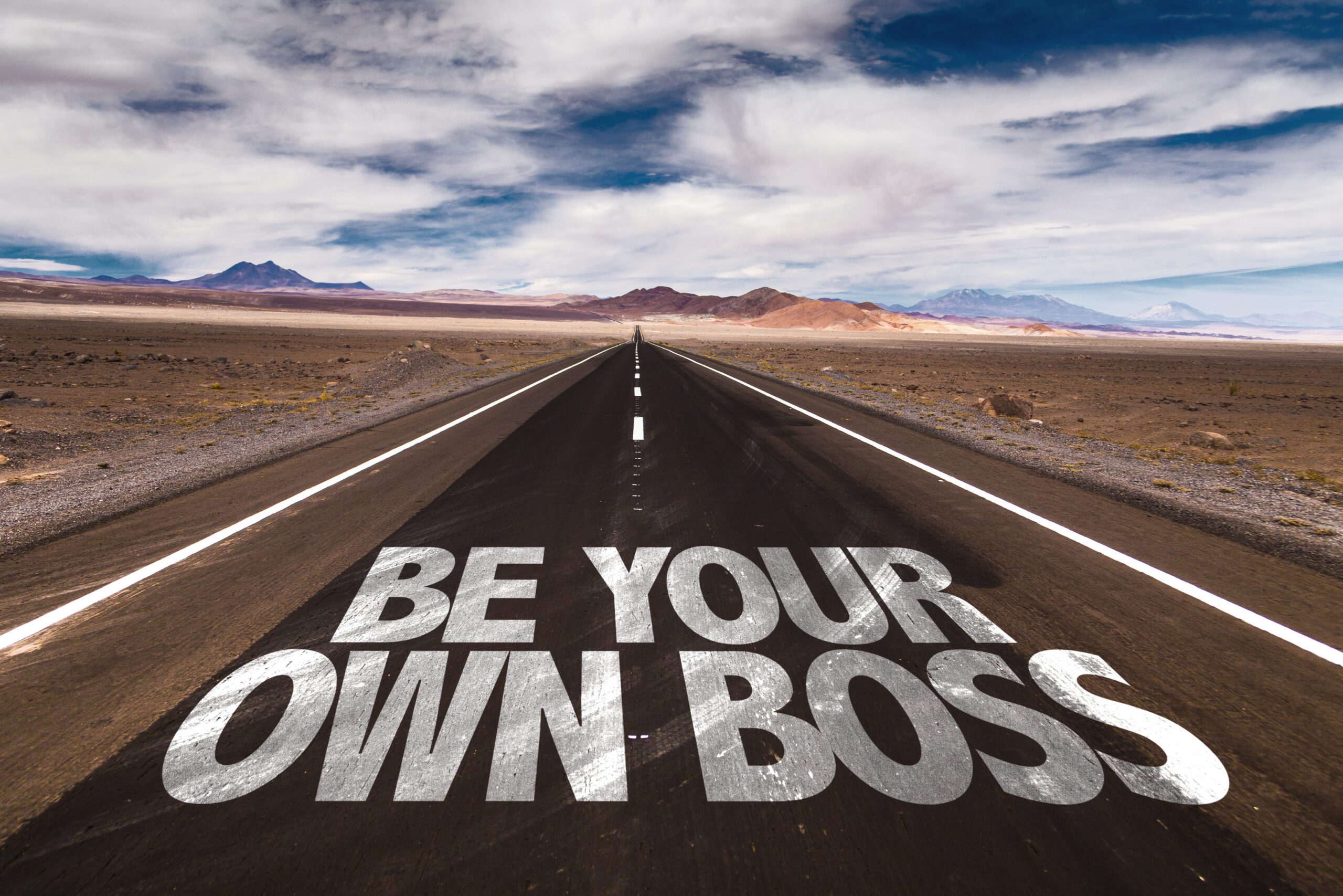 Be Your Own Boss written on desert road